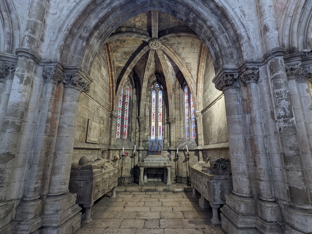 an alcove with a stained-glass window